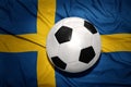 Black and white football ball on the national flag of sweden Royalty Free Stock Photo