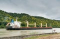 Black and white freighter cargo ship traveling along the Seine River from Paris to the English Channel