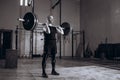 Black and white full length portrait of Strong man lifting a barbell during crossfit workout at gym Royalty Free Stock Photo