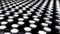 Black and white geometric surface of glossy shiny honeycombs. 3D rendering of reflective hexagons connected together in