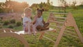 Black And White Girl Sitting On Wooden Slide. Girls Smiling. Cheerful Children. Royalty Free Stock Photo