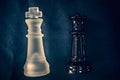 Black and white glass King and Queen chess pieces Royalty Free Stock Photo