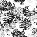 Black and white grunge abstract seamless pattern with circles, rings, different brush strokes and shapes.