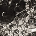 Black and white grunge sepia background with vintage clock mechanism texture. Royalty Free Stock Photo