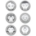 Black and white Halloween Monster skulls such as vampire, zombie, Woolf man, cyclops and mummy in button form with a shadow elem