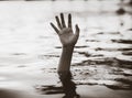 Black and white hand of drowning man needing help Royalty Free Stock Photo