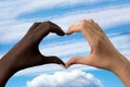 Black and white hands in the form of heart  on white background. Interracial friendship stop racism concept Royalty Free Stock Photo