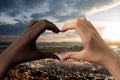 Black and white hands in the form of heart on white background. Interracial friendship stop racism concept