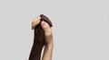 Black and white human hands in a modern handshake on a gray isolated background. The concept of combating racism Royalty Free Stock Photo