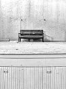 Black and White Image of Bench sitting on theater stage