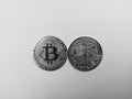 Black and white image of bitcoin with front and back side representing electronic digital cryptocurrency of the future on the Royalty Free Stock Photo