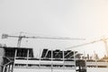 Black and white image of building crane and buildings under construction Royalty Free Stock Photo