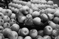 Black and White Image of Bunch of red, yellow and green apples on boxes in supermarket. Apples being sold at public market. Royalty Free Stock Photo