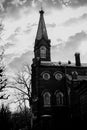 The black-white image captures the image of an old Lutheran city church. The monochrome aesthetic emphasizes the architectural