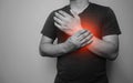 A black and white image Closeup of male arms holding his painful wrist  From arthritis symptoms Royalty Free Stock Photo