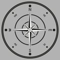 Black and white image of a compass in a flat rear. Isolated on gray background Royalty Free Stock Photo