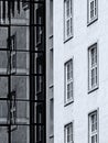 Black and white image of contrast of old and modern architecture with reflection Royalty Free Stock Photo