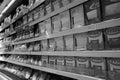 Black and White Image of Different types of cheese on shelves in a grocery store. Shelf of packaged products, butter and cheese at Royalty Free Stock Photo