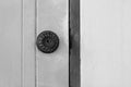 Black and white image of door knob on old door. Royalty Free Stock Photo