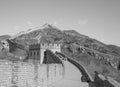 Great Wall of China: Black and white shot of section with towers winding over a mountain ridge under a clear sky Royalty Free Stock Photo