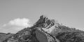 Black and white view of the Great Wall of China going up to the top of a mountain ridge