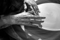 Black and white image of the hands of a young female potter Royalty Free Stock Photo
