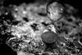 Sand clock on broken glass pieces in blur. Royalty Free Stock Photo