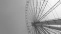 Black and white image of a large ferris wheel