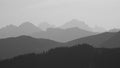 Black and white image of mountain ranges in the morning light