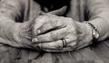 Black and white image of old lady`s clasped hands. Royalty Free Stock Photo