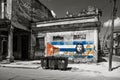 Black and white image of old shabby buildings in Havana with a painting of Che Guevara and a cuban flag Royalty Free Stock Photo