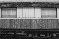 Black and White image of old used train bogey discharged in the park.