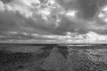Black and white image of a pathway going out into the sea at Westlcliff Royalty Free Stock Photo