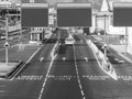 Black and white image of payment collecting post on busy highway with empty blank road signs, Place for your text. Copy Royalty Free Stock Photo