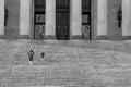 Black and white image of people walking up the steps of the Washington State Capitol building Royalty Free Stock Photo