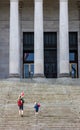 Black and white image of people walking up the steps of the Washington State Capitol building Royalty Free Stock Photo