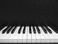 Black and white image of piano press key.