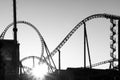 Black and white image, silhouettes of roller coasters. Background texture. Amusement park