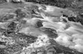 A Black and White Image of a Small Waterfall on a Wild Mountain Stream Royalty Free Stock Photo