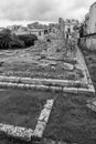 Black and white image of stone ruins with wall