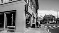 Black and White Image Three Anonymous Girls Or Women Walking Past A Wagamama Asian Food Restaurant