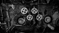 Black and white photo of valves and faucets on old steam powered train engine Royalty Free Stock Photo