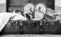 Black and white image of vintage leather suitcase packed with tr Royalty Free Stock Photo