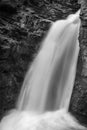 A black and white image of a waterfall taken on a loing exposure to smooth out the cascading waters