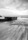Black and white image wave hitting the coastline Royalty Free Stock Photo
