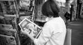 Black and white image of woman reading Aujord'hui French newspap Royalty Free Stock Photo