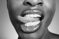 Black and white photo of woman sticking out tongue