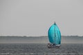 Sailboat with a Blue sail on the Chesapeake Bay outside of Annapolis Maryland Royalty Free Stock Photo