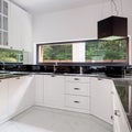 Black and white kitchen with long window