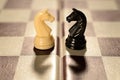 Love couple or Enemy confrontation Chessmen checkered board Royalty Free Stock Photo